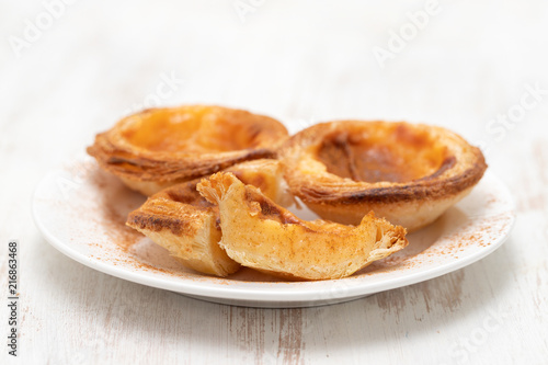 typical portuguese egg tart pastel de nata with cinnamon