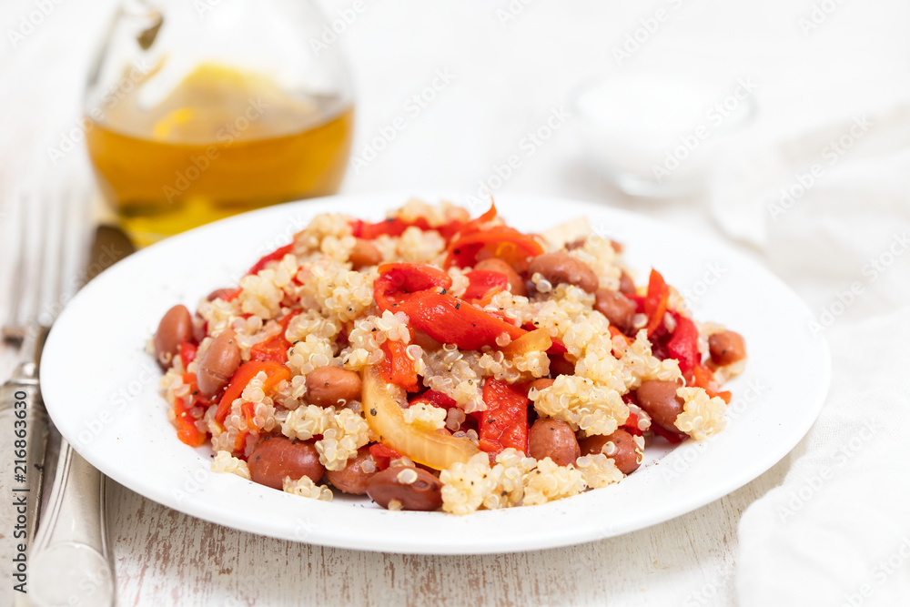 salad with quinoa on white plate on white background salad with quinoa on white plate on white background
