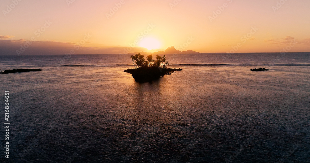sunset on an islet in French Polynesia