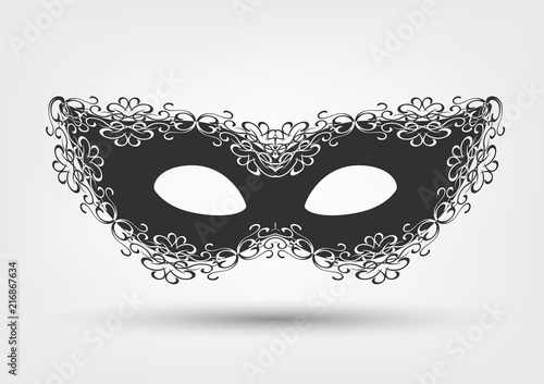 Black masquerade mask with lace on white background, carnival