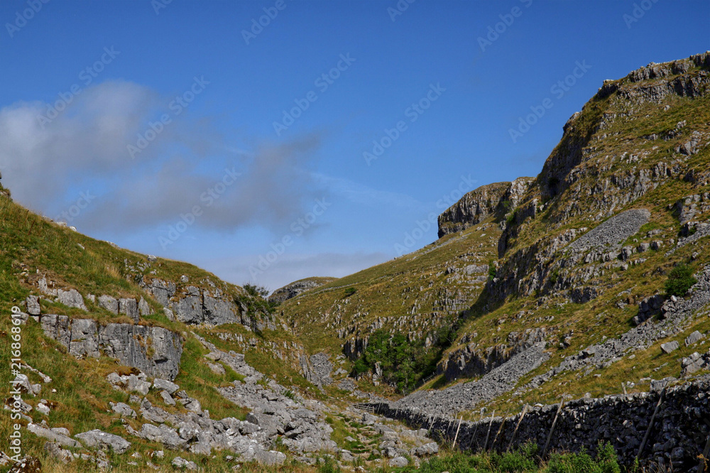 Malham Lings and Ewe Moor in the summer sun with deep blue skies. Karstic limestone landscape scenery in the Yorkshire Dales National Park