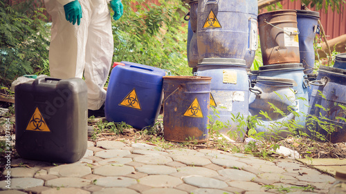 Fotografie Asian scientist wear Chemical protection suit check danger chemical,working at d