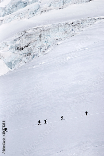 A group of climbers crossing Gara-Bashi glacier on Elbrus slope.