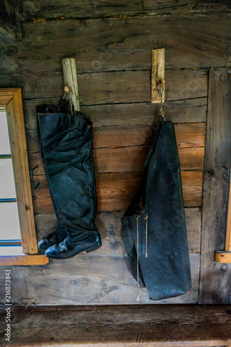 Ancient rural interiors. Fisherman's boots. photo