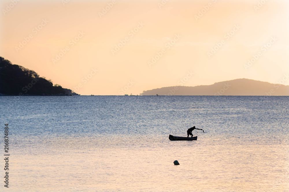 Fisherman of Malawi lake at sunset