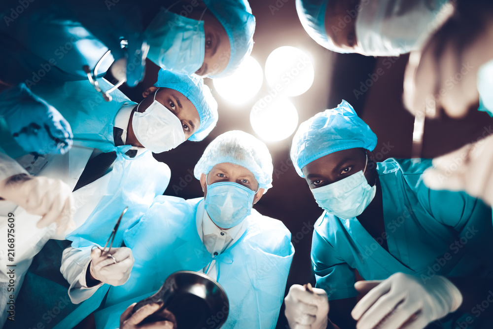 © VadimGuzhva - Doctors Staring On Patient. Operating Table Look.