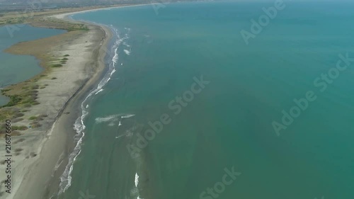 Aerial view of sandy beach Lingayen with azure water on the island Luzon, Philippines. Seascape, ocean and beautiful beach. photo