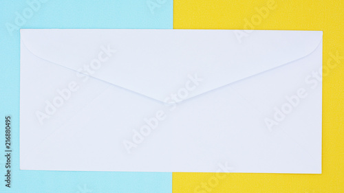 white envelope mail on blue and yellow background