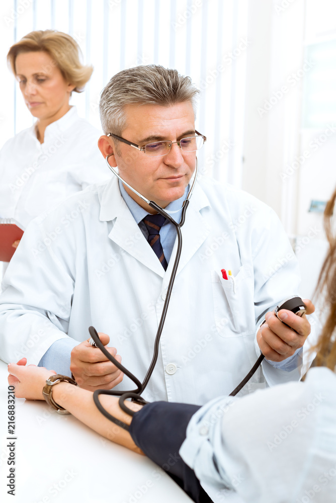 Offering his expert advice to his patient Offering his expert advice to his patient