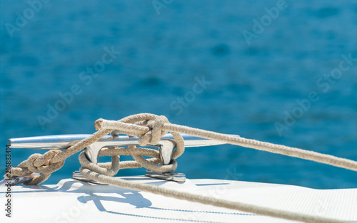 Fotografie Detail image of yacht rope cleat on sailboat deck.