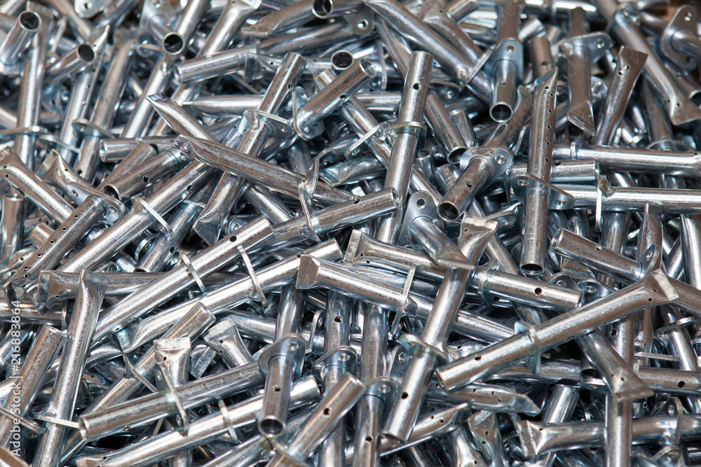 Many metal parts with holes. Press treatment. A lot of small parts Many metal parts with holes. Press treatment. A lot of small parts
