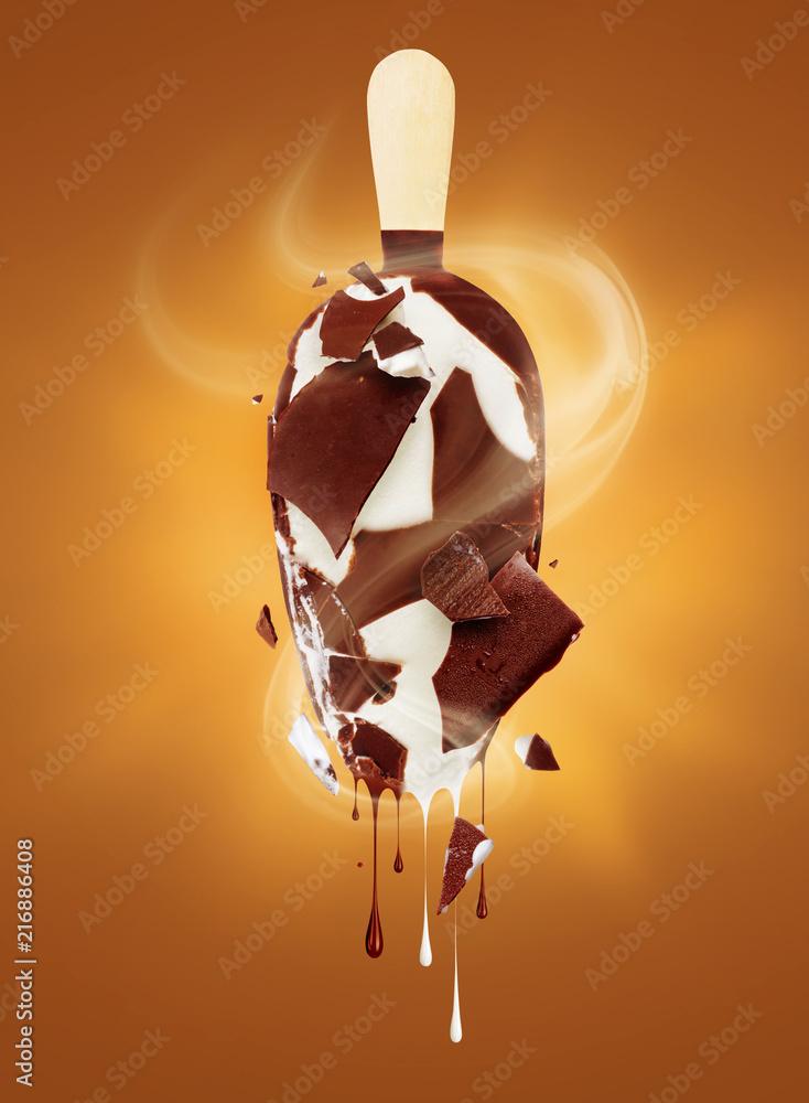 Chocolate and milk drip from melted ice cream on an orange background