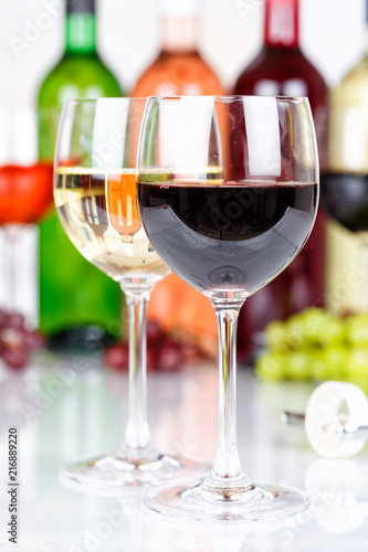 Red wine in a glass portrait format grapes