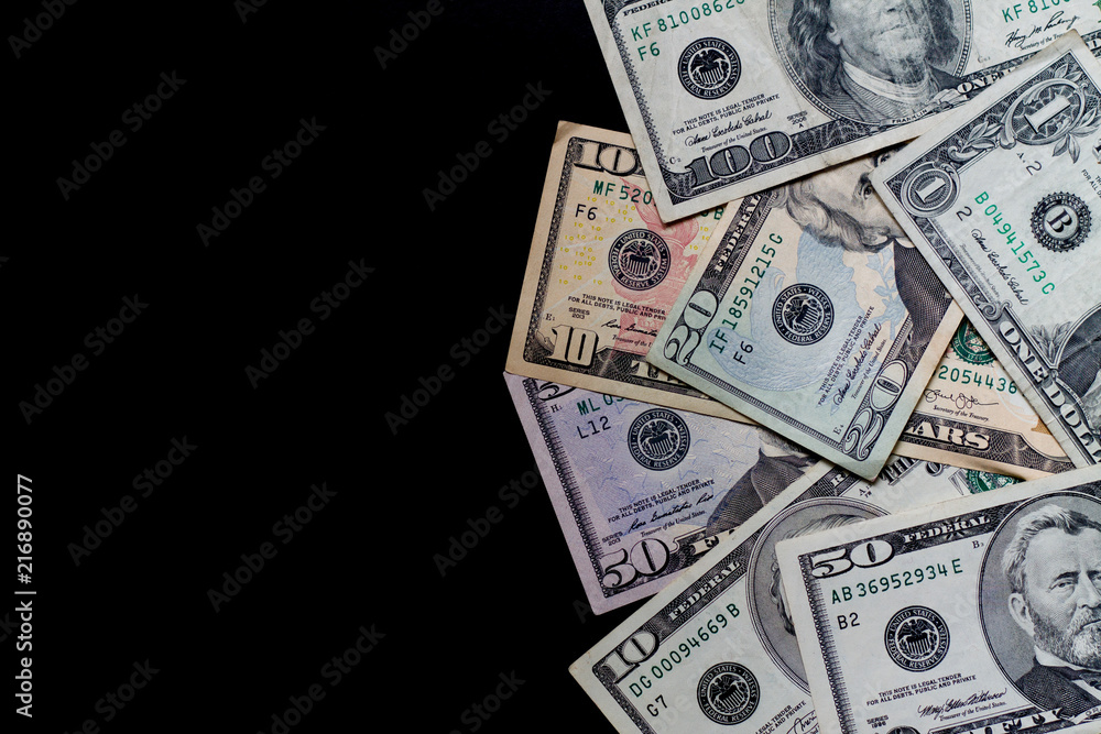 US dollar foreign currency dolar on a black background US dollar foreign currency dolar on a black background