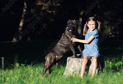 little girl and dog outdoors