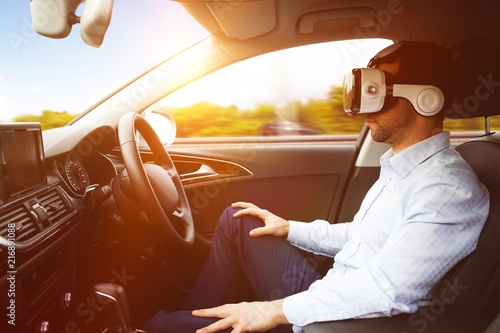 man behind the wheel wearing a virtual reality helmet © vectorfusionart
