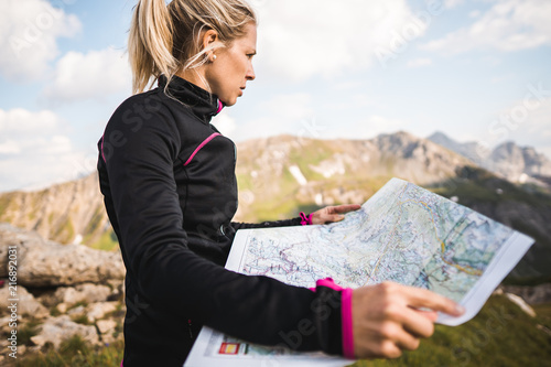 Tableau sur toile Adventurous mountain girl surrounded by beautiful mountains