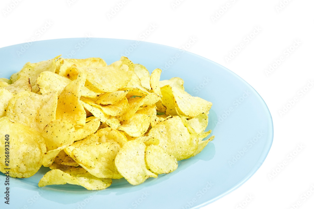 Potato chips on blue plate. Isolated on white background Potato chips on blue plate. Isolated on white background