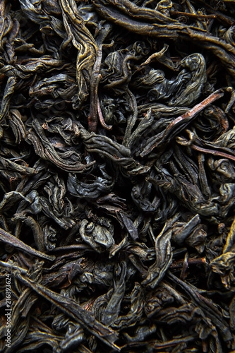 Black tea loose dried leaves. Background