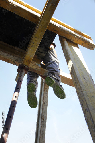 worker / construction worker on building