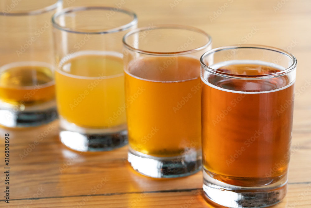 Rainbow selection of beer with ascending volumes Rainbow selection of beer with ascending volumes