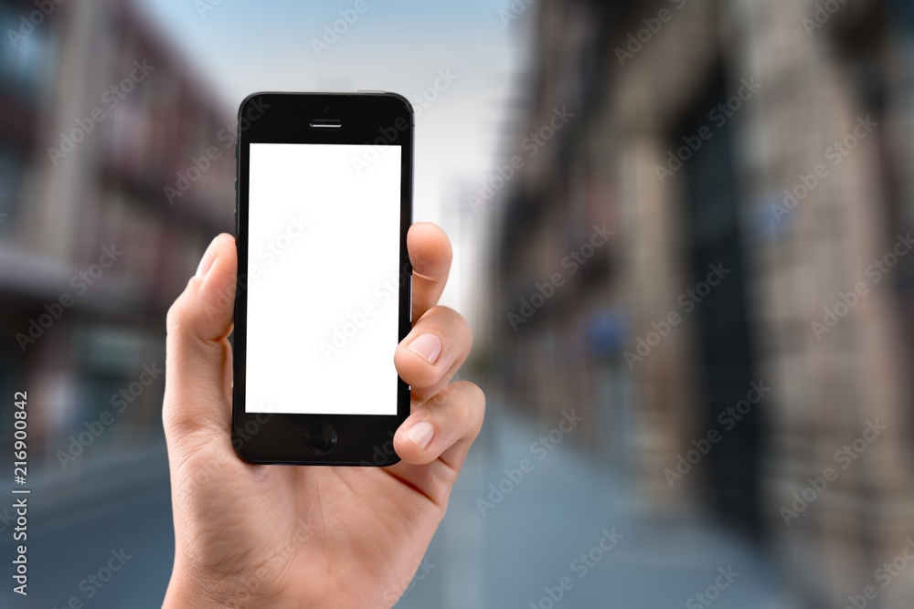 Hand Holding an Phone on city background Hand Holding an Phone on city background