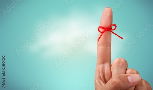 Rope bow on finger pointing photo
