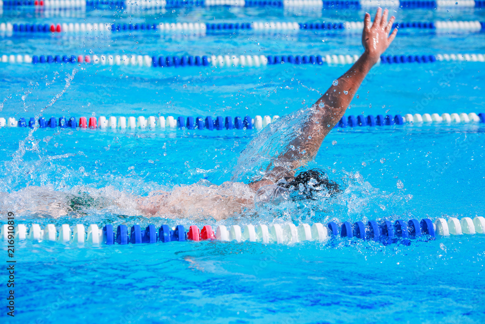 Backstroke swimmers in a race