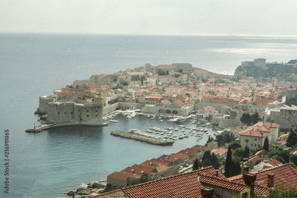 Old town of Dubrovnik, Croatia, seen from above with the Adriatic see in the background. The place is one of the major hotspots for Croatian tourism