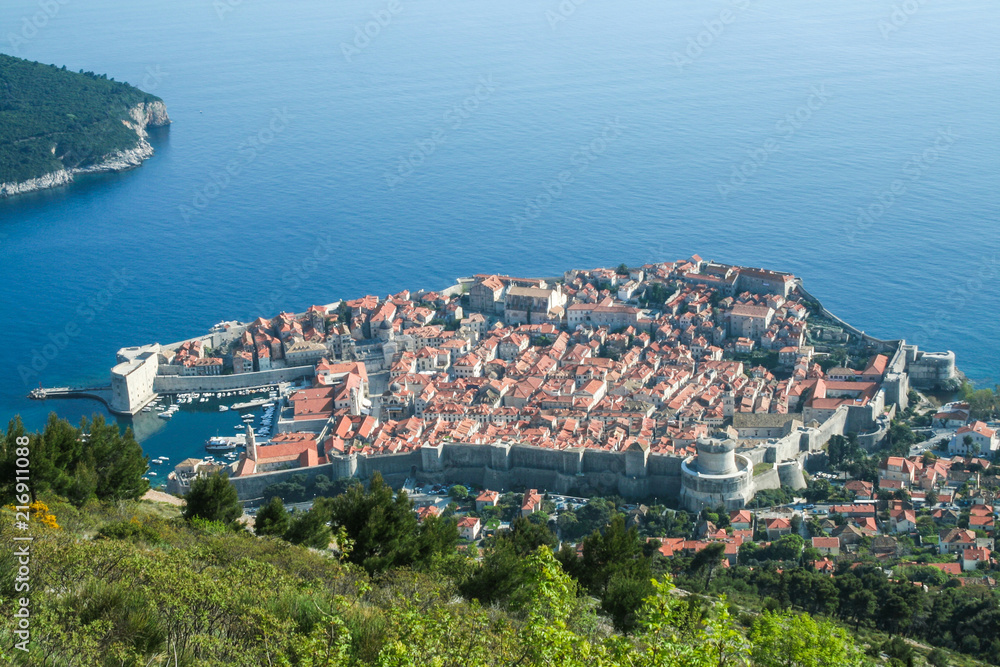 Old town of Dubrovnik, Croatia, seen from above with the Adriatic see in the background. The place is one of the major hotspots for Croatian tourism