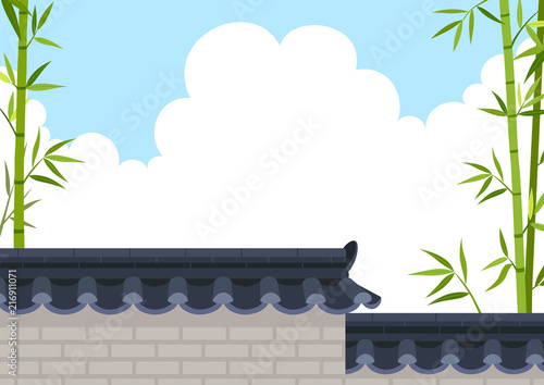 Traditional Korean style stone wall fence with bamboo on sky background