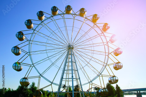 Ferris wheel in the amusement park. On the Sunset.