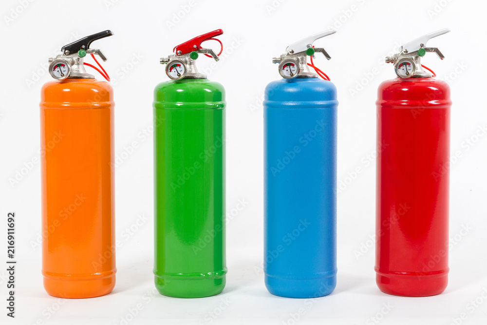 Obraz premium Group of colorful retro fire extinguishers isolated on white background