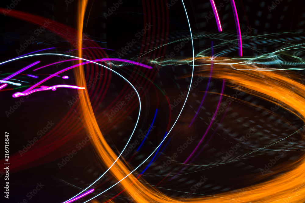 Fototapeta premium Abstract background with color lines. Bright abstract pattern in a color different lines on a black