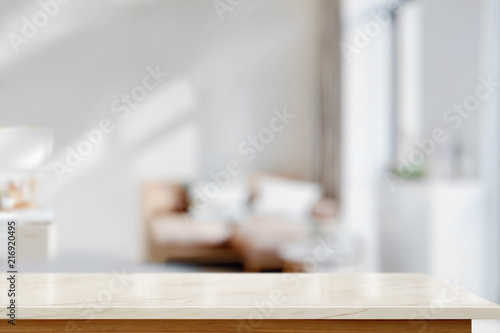 White marble top table for display montage over bright living room background.
