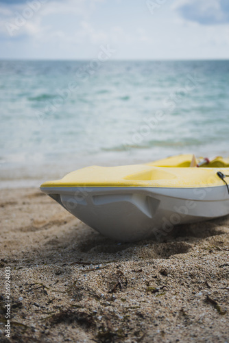 Yellow Kayak Placed On The Beach