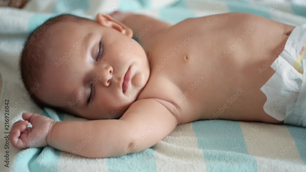 sleeping baby happy and carefree indoors during noon nap bedtime sleeping baby happy and carefree indoors during noon nap bedtime