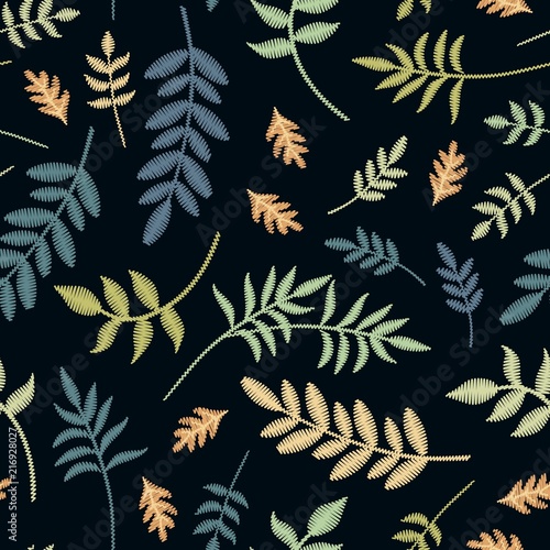 Embroidery seamless pattern with different leaves on black background. Vector illustration.