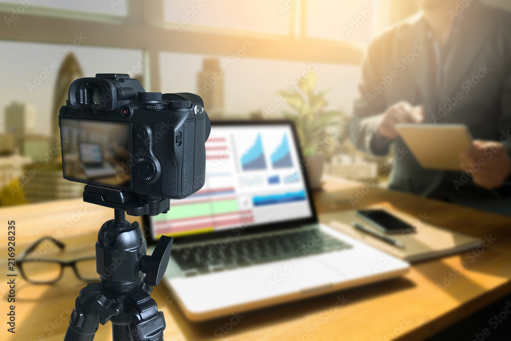 Fototapeta premium vlogger using laptop sharing her content making recording video for her vlog trends