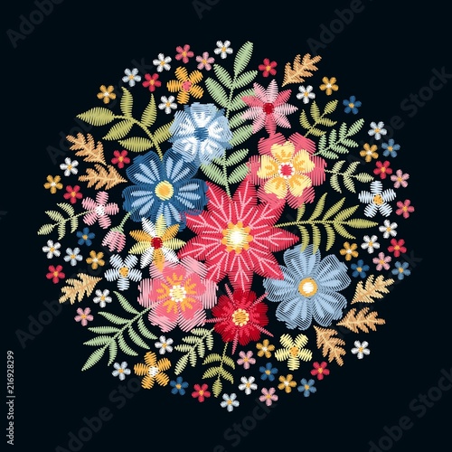 Embroidery. Round pattern with colorful wild flowers and leaves. Cute circle floral composition on black background. Summer bouquet. Vector print.