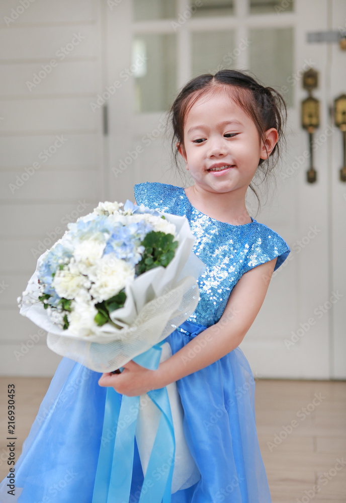 Cute little Asian child girl with Bouquet of flowers in the garden. Cute little Asian child girl with Bouquet of flowers in the garden.