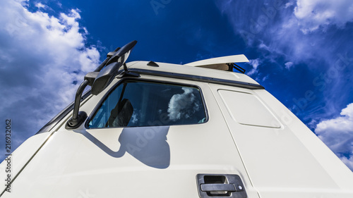 Blue sky over white truck