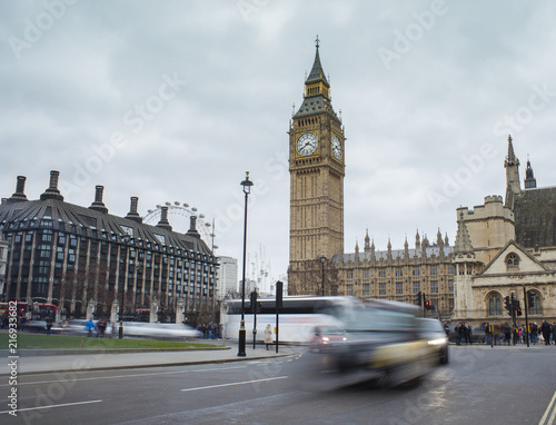 car traffic in London city. Big Ben in background, long exposure photo