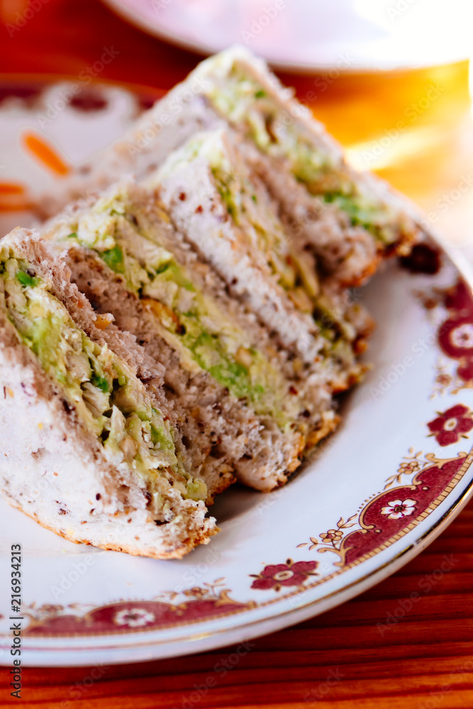 Chicken avocado sandwich in a plate. Chicken avocado sandwich in a plate.