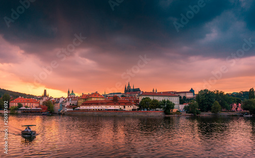 Stunning cityscape of Prague on a sunset in Czech Republic. Vltava river, Prazsky hrad (Prague castle). © Evgeni