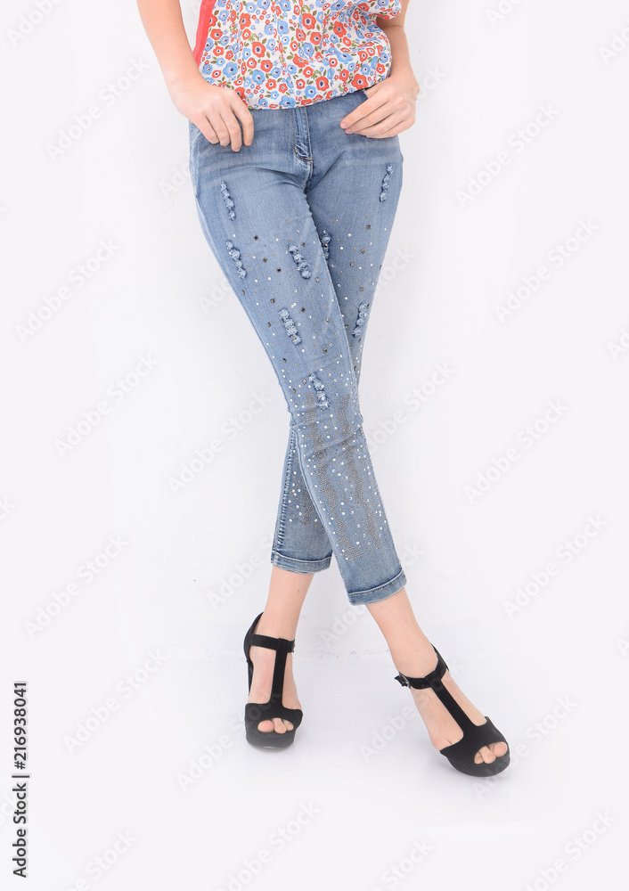 women legs in jeans with black high hell black waling in studio women legs in jeans with black high hell black waling in studio