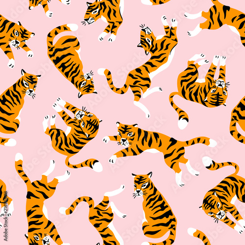 Vector seamless pattern with cute tigers on the pink background. Circus animal show. Fashionable fabric design.