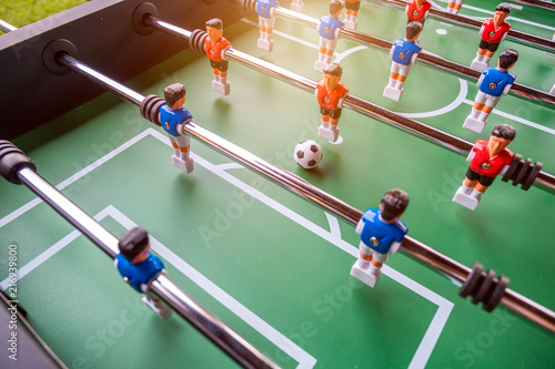 Bild auf Leinwand Close-up of Table football soccer game on green field