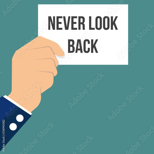 Man showing paper NEVER LOOK BACK