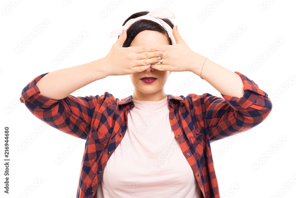 Young pretty pin-up girl wearing glasses and covering eyes gesture.